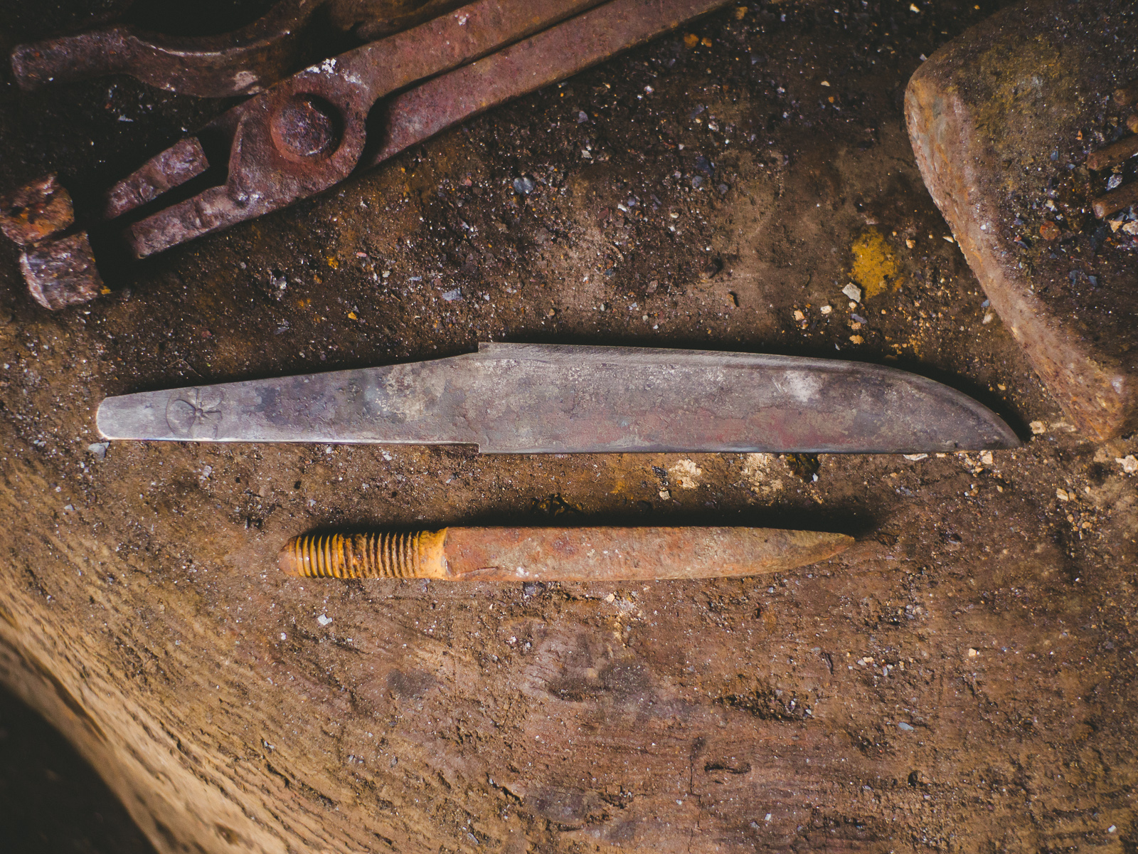 Island Blacksmith: Charcoal forged knives reclaimed from farm tools.